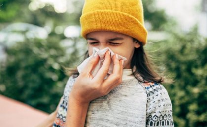 A child blowing nose